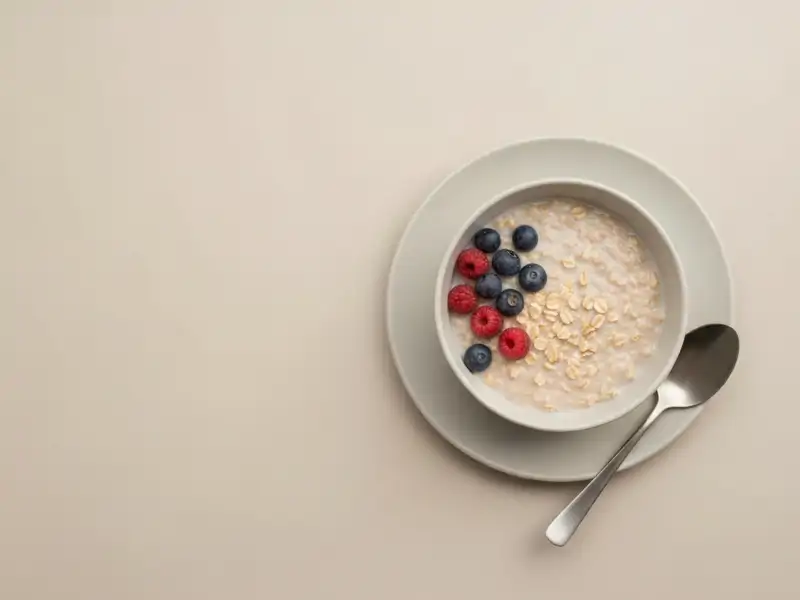 A bowl of oatmeal with fresh berries