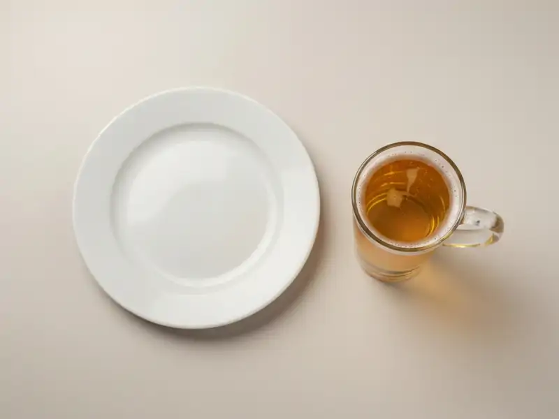 A pint glass of pale lager